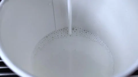 Vending coffee machine prepare latte. Milk is being poured. Stock-Footage 279253734