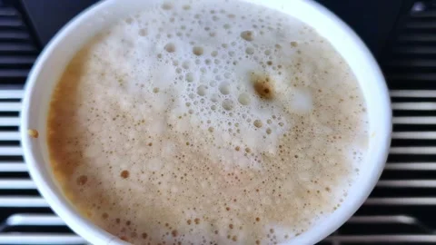 Vending coffee machine prepare latte. Morning drink is poured into a cup. 動画素材 281561699