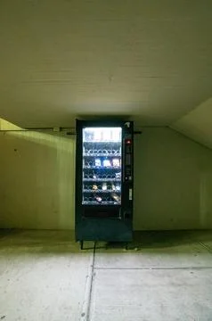Vending machine, with interior light, wall, ceiling and concrete floor Stock Photos