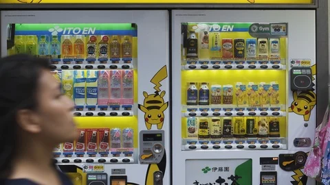 A vending machine selling beverages featuring a Pokémon pikachu. Stock Footage 94332717