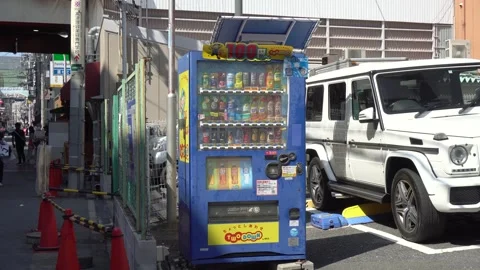 Vending machine selling refreshing cold drinks for 100 yen in Osaka, Japan - Stock Footage 264171780