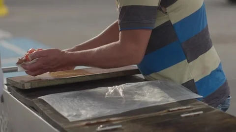 Vendor Adding Ice Cream and Toppings to Traditional Mexican Dessert Stock Footage 341919655