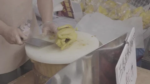 Vendor Chops Cooked Chicken on a Market Cutting Board Stock Footage 340137584