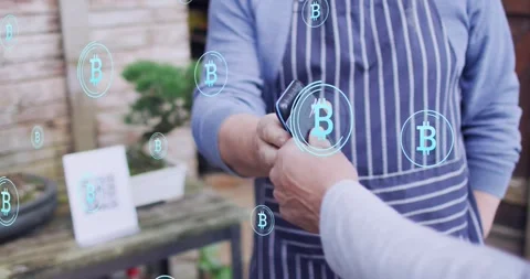 Vendor holding reader, buyer tapping card at stall, Bitcoin tokens rising Stock Footage 321550812