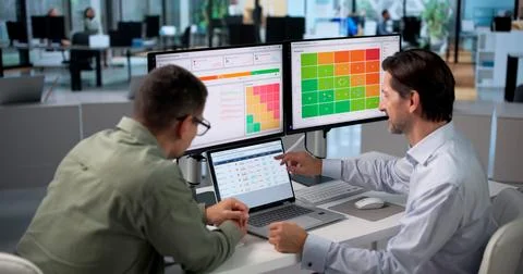 Vendor Manager And Colleague Using Software Platform For Risk Assessment. Stockfoto's