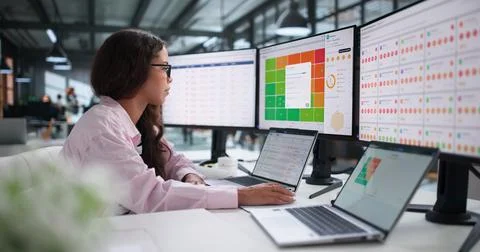 Vendor Risk Manager Analyzing Third-party Compliance Data On Laptop Screen Ca Stock Photos