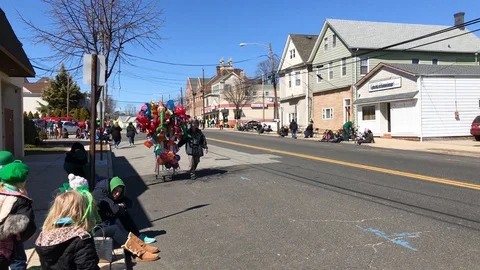 A vendor selling things before a parade Stock Footage 87575999