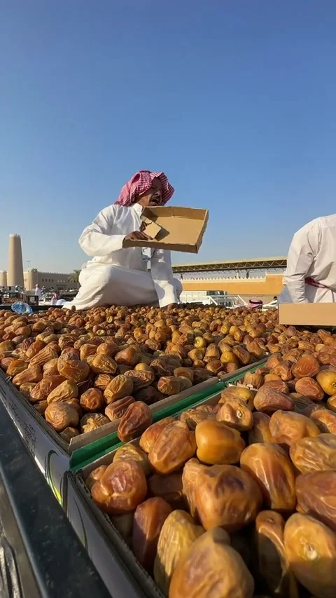 Vendor Sorting Fresh Dates at Outdoor Market Stock Footage 346533470