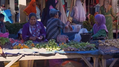 Vendors chatting among themselves while waiting for buyer at traditional mark Stock-Footage 106852328