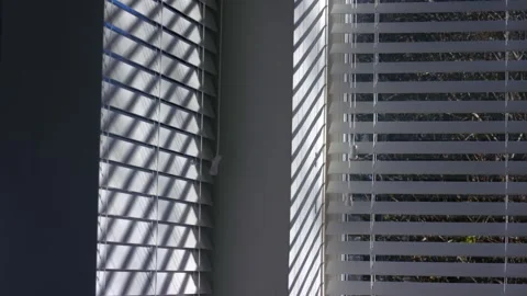 Venetian blinds window slats string in sunlight shadows Stockbeeldmateriaal 326358384