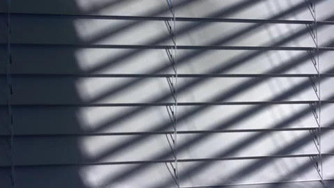 Venetian blinds window slats string in sunlight shadows Stock Footage 331944344