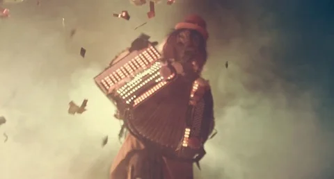 Venetian fancy accordion player in the smoke and darkness. Masquerade. Stock Footage 70987056