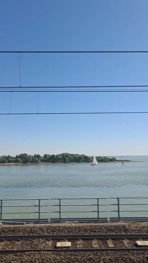 The Venetian Lagoon from a train window crossing The Ponte Della Libertà Stock Footage 344687180