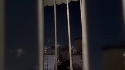 Venezuela: Unidentified Drones Trigger Anti-Aircraft Fire Near Caracas Pr... Video stock 325768367
