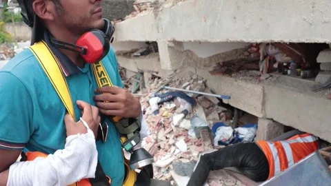 Venezuelan miners abandon their underground gold mining to find earthquake victi Stock Footage 338404553
