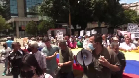 Venezuelan workers demand better working conditions during May Day protest, VENE Stock Footage 204129216