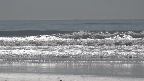 Venice Beach small waves break.  No people, empty beach￼ Stock Footage 121242082