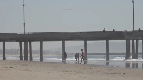 Venice Beach small waves break. The pier in background. Stock Footage 121245005