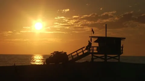 Venice beach Sunset slow-motion lifeguard pack up for day. 0012WL Stock Footage 19389216