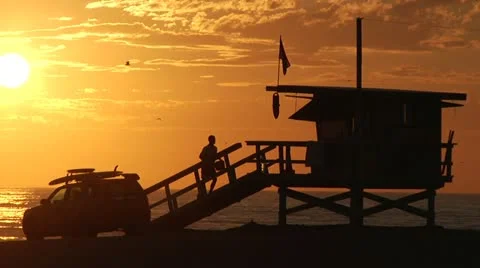 Venice beach Sunset in slow motion. Lifeguard tower and truck 0017KO Stock Footage 19401138