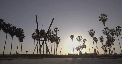 Venice Beach - Tracking Towards Main Courtyard Sculpture During Golden Hour Stock Footage 86242669
