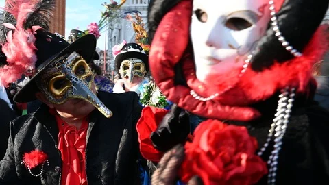 Venice - carnival masks are photographed with tourists in Piazza San Marco Stock Footage