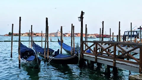 Venice gondolas gently rocking on the waves Stock Footage 313897028
