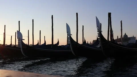Venice gondolas moving up and down in the morning light setting a peaceful scene Stock Footage 174857881