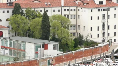 Venice, Italy - 2018/04/15: Empty waterfront terrace near small bridge Stock Footage 331664323