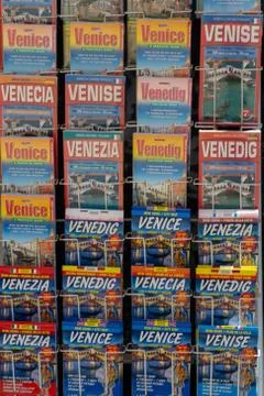 Venice maps displayed in order in different languages. Venice, Italy Stock Photos