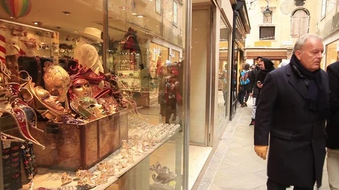Venice mask shops and reflection of the tourists on windows Stock Footage 72617421