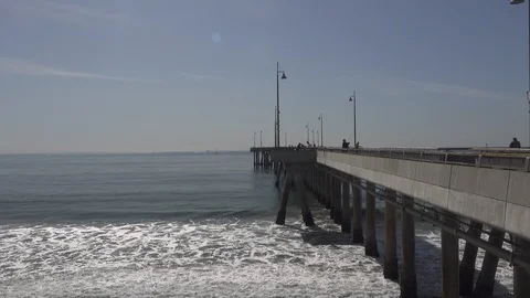 Venice pier looking down the pier,  the Pacific Ocean and the razor. Stock Footage 121326784