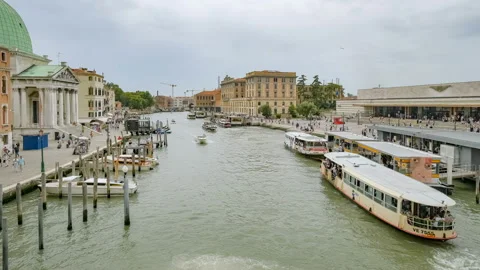 Venice railway train station view with people walking and tourist boats,Italy Stock Footage 210757913