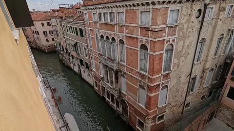 Venice - Scenic Window View of Rooftops and Canal Bridge Stock Footage 341388529
