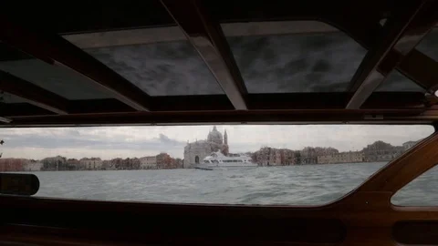 Venice skyline framed in window of speedboat Stock Footage 97785441
