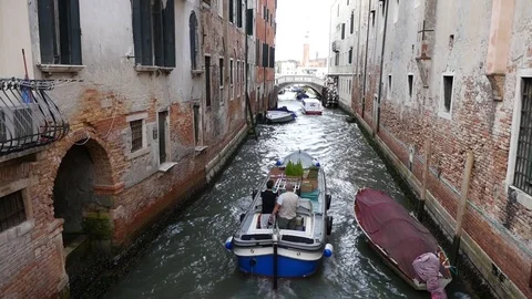 Venice slow motion of workboat in canal. Stock Footage 70332689