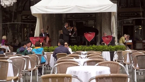 Venice St. Marks Square string quartet plays outside restaurant Stock-Footage 98987014