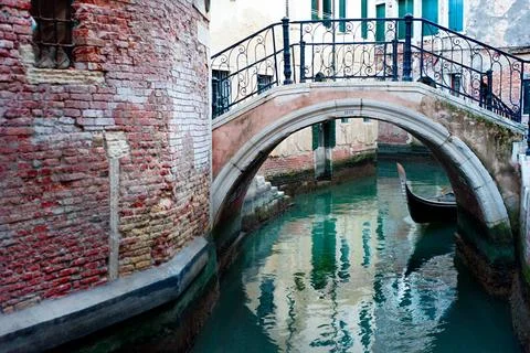 Venice street Gandola under the bridge on a small Venice street Copyright:... Stock Photos