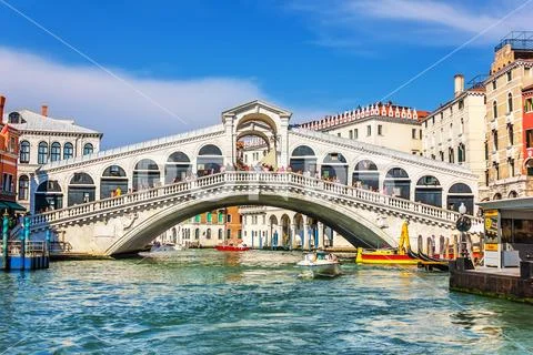 Venice,Italy - August 22, 2018: The Rialto Bridge and many tourists on a summer Stock Photos