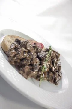 Venison stroganoff with bread dumpling Stock Photos