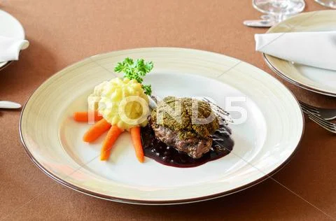 Venison with whortleberry sause Stock Photos