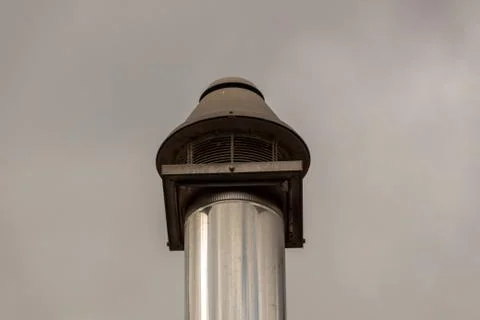 Vent pipe against a gray sky Stock Photos
