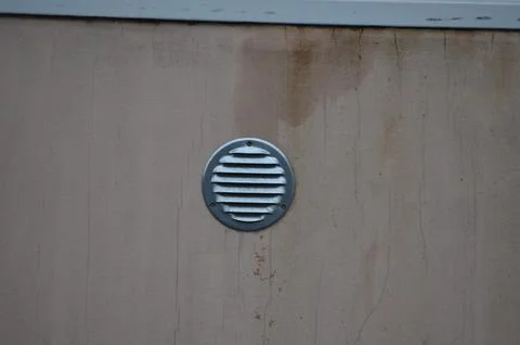 A vent is on the wall.  Stock Photos