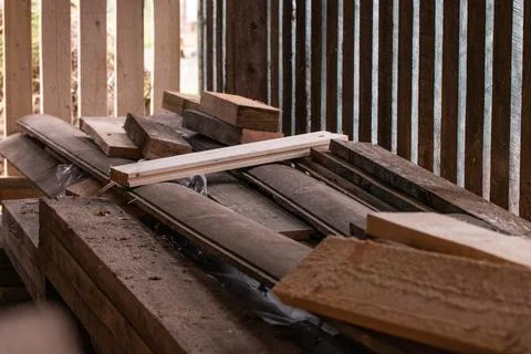 Ventilated timber warehouse. How to make timber warehouse. Build a log store. Stock Photos