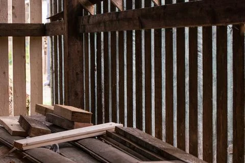Ventilated timber warehouse. How to make timber warehouse. Build a log store. Stock Photos