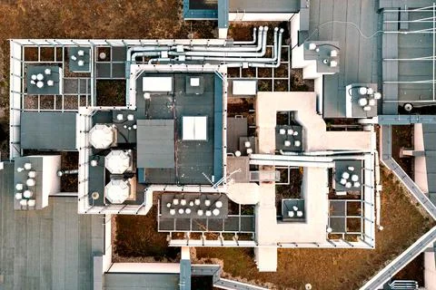 Ventilation and air conditioning system on the roof of the house. View from a Foto stock