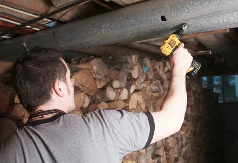 A ventilation cleaner man at work with tool Stock-Fotos