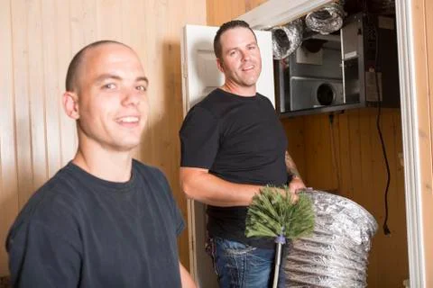 Ventilation cleaner man at work with tool 스톡 사진