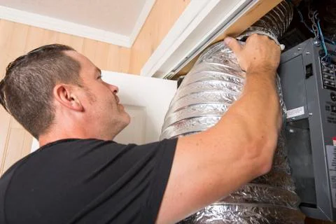 Ventilation cleaner man at work with tool Stock-Fotos