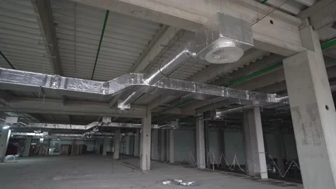 Ventilation ducts inside a large warehouse under construction. Stock Footage 218471347